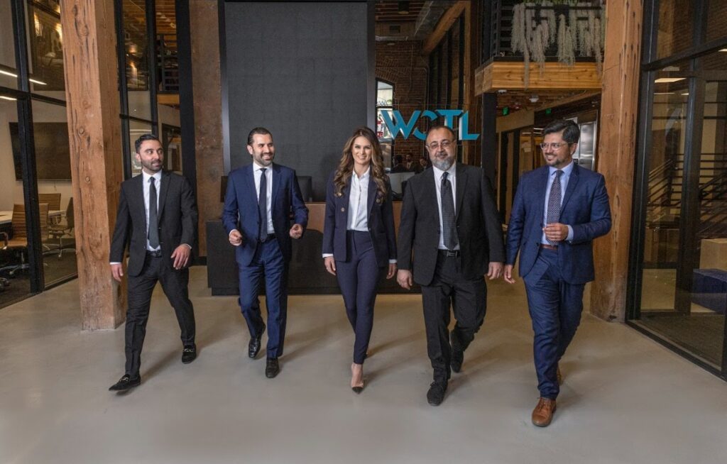 WCTL attorneys walk through their HQ location's lobby.