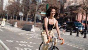 A woman riding a bike in the city.