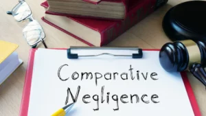 A clipboard with the phrase 'Comparative Negligence' written down.
