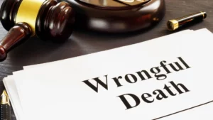 A gavel and a sheet of paper labeled "Wrongful Death".