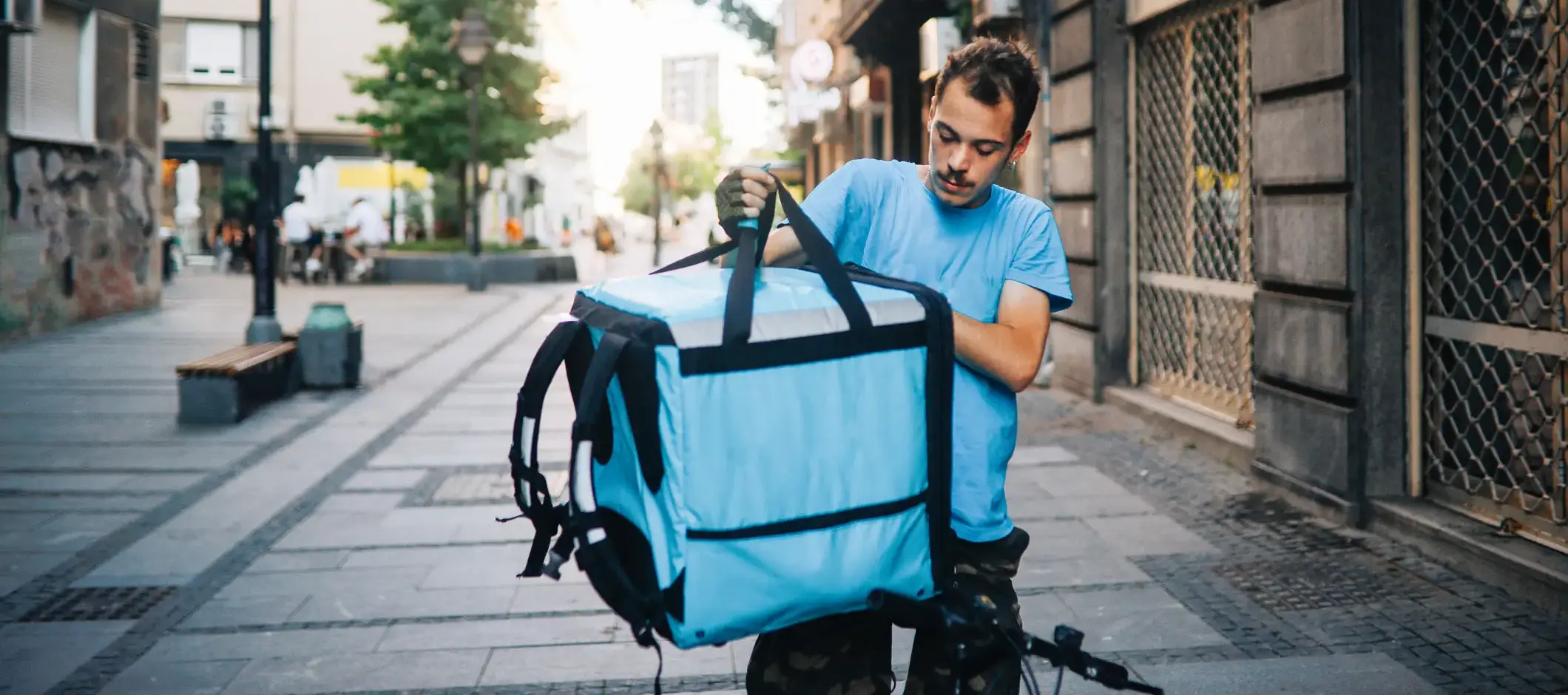 A man delivering food to his customer.