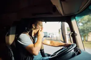 A yawning truck driver.