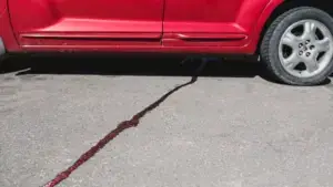 A red car leaking fluids.
