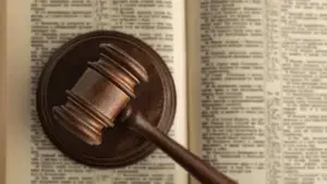 A gavel on top of a law book.