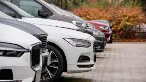 A row of cars in a parking lot.