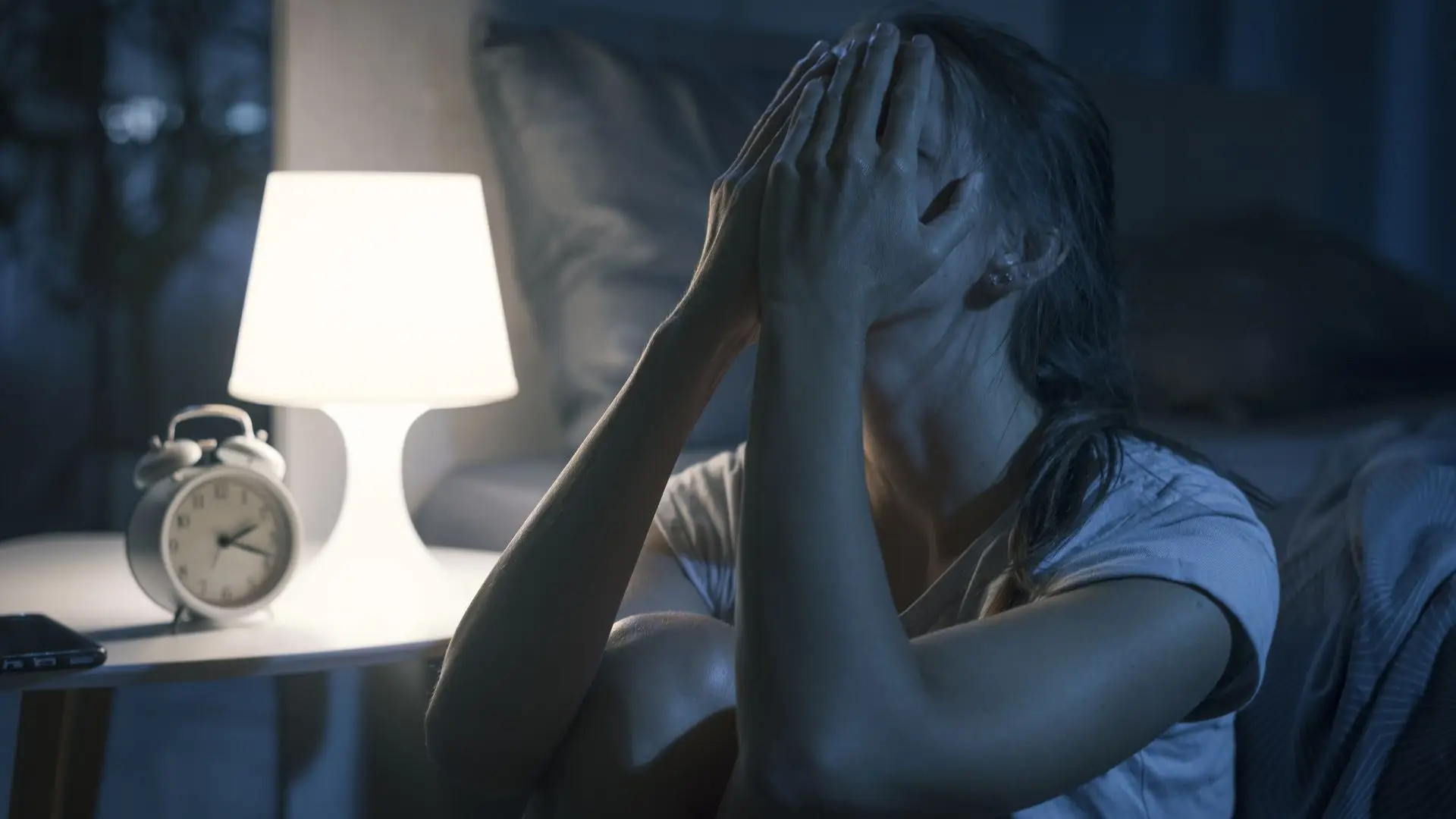 A depressed woman, crying in the middle of the night.