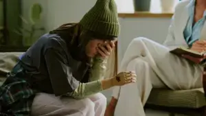 A little girl experiencing emotional distress after losing a hand.