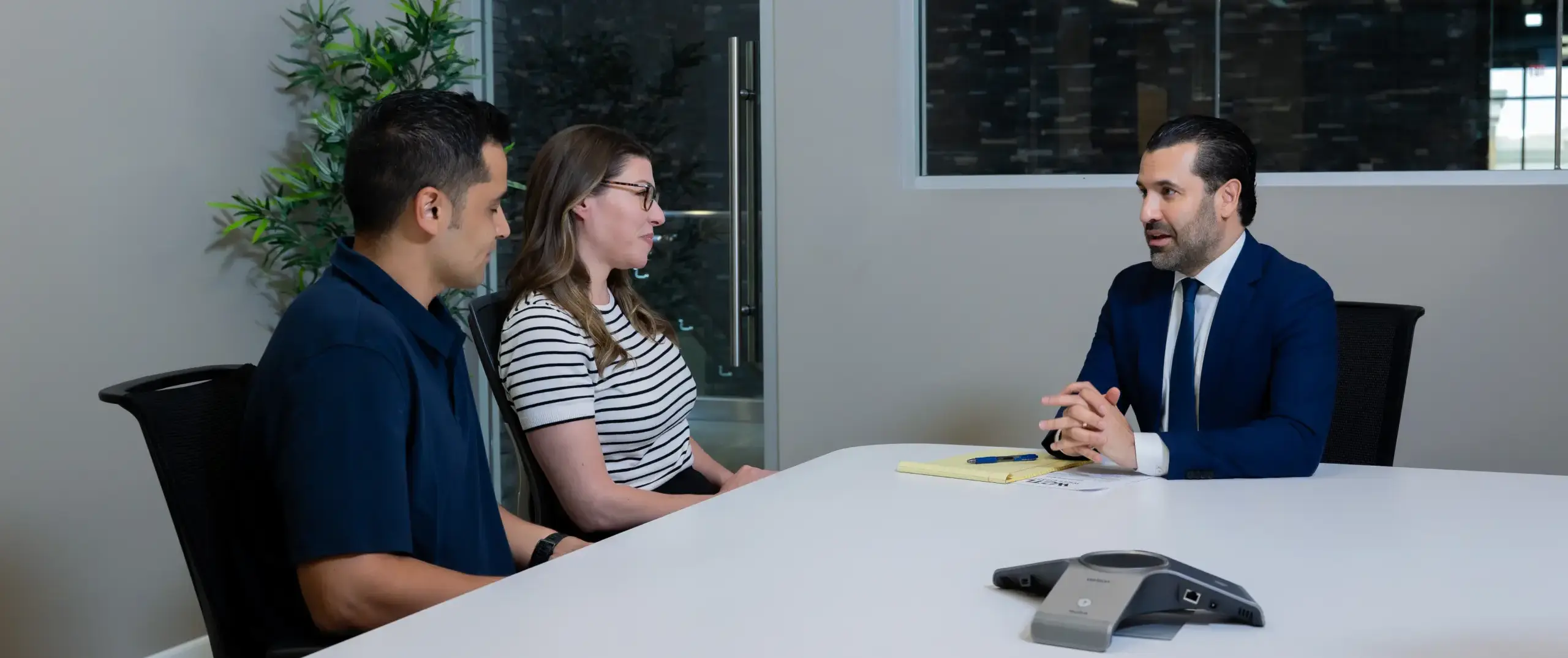 Neama consulting with two clients.