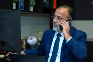 WCTL Co-CEO Allen talking on the phone with a client.