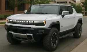 A White GMC Hummer on a street.