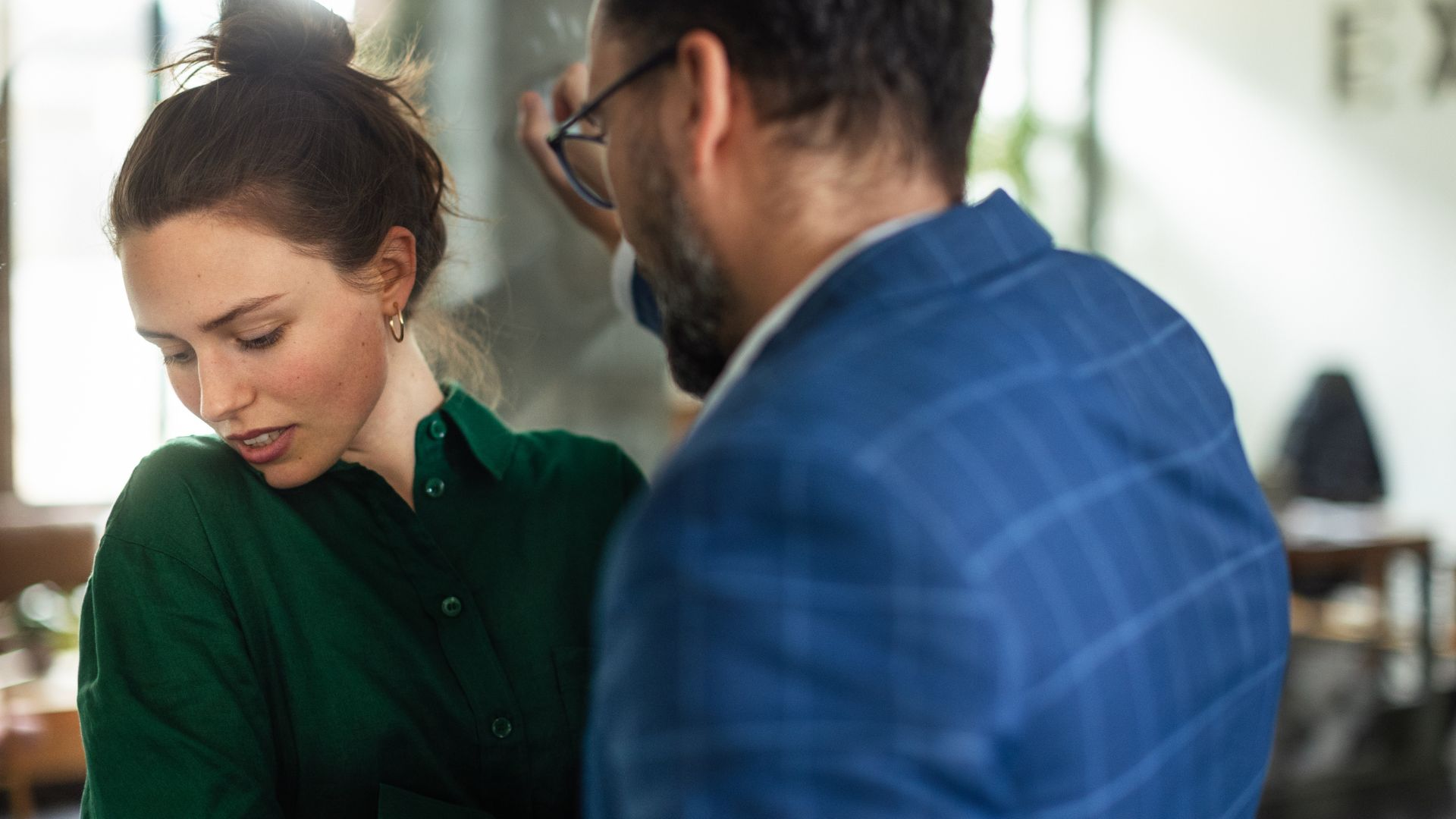 An angry man getting up in a woman's face.